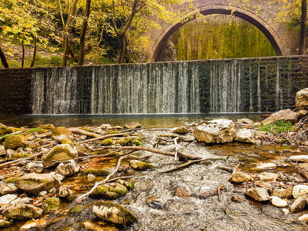 arced bridge of palaiokarya in trikala perfecture greece autumn colors waterfalls 