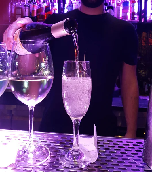 bar wine glasses barman pouring wine from the bottle drink  for background
