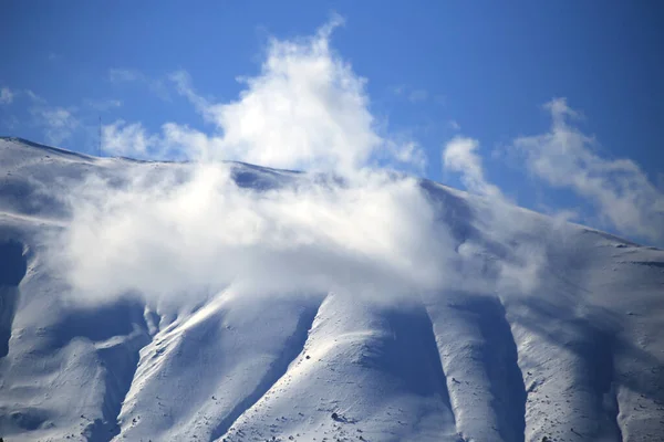 snow mountain tree clouds peak in mestovo area,  anilio city winter in  greece