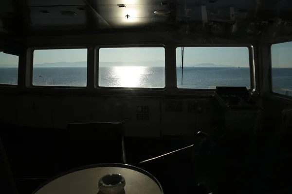 ship captain window bue aegean sea voyage in summer greece
