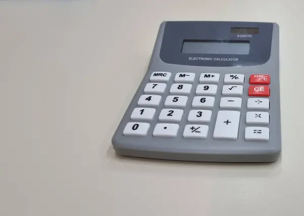 calculator electronic computer pocket on empty background buttons account school