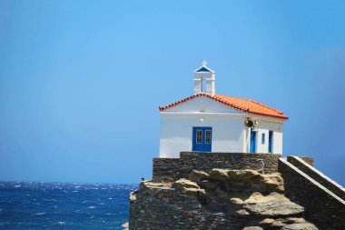andros island greece panagia thalassini church wavy sea in windy sunny day
