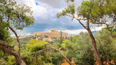 athens parthenon greece from philopappos monumnet view pine trees cloudy day clipart