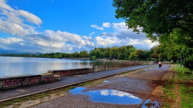 ioannina or giannena  lake after rain in autumn greece clipart