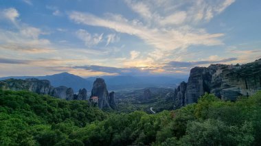 meteora churches in kalampaka city greece sunset time clouds colors sunset clipart