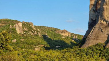 meteora churches and rocks view from kastraki village in auutmn season clipart