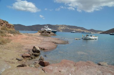 panormos beach and ships  in mykonos or mikonos island in greece   clipart