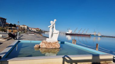 mermaid scalpture in preveza port sea ship granes  in greece clipart