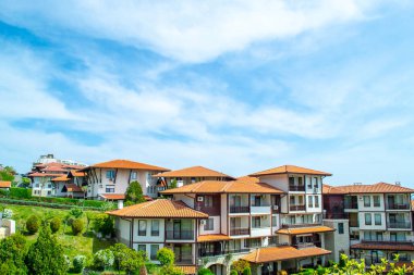 Red tiled roofs of luxury villas and the patio of the hotel cascade complex in the resort village of Sveti Vlas in Bulgaria. High quality photo
