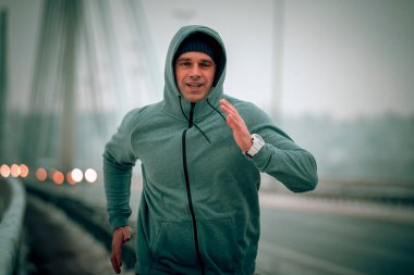runner at the bridge have a training on snowy and cold weather