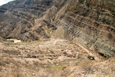Mountain landscape and road through the desert to the canyon of the Leon River. Andes, Ecuador, Azuay Province, Nabon Canton