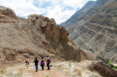 Azuay, Ecuador - January 15, 2023: Mountain landscape and tourists on the road through the desert to the canyon of the Leon River. Andes, Ecuador, Azuay Province, Nabon Canton