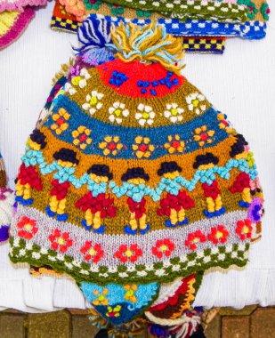 Peruvian knitted men's hat called Chullo is a Cusco style with typical pattern at Indian market in Lima, Peru