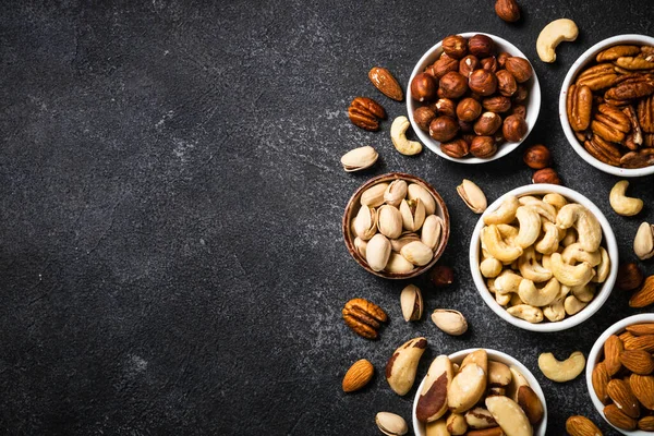 Nuts Bowls Cashew Hazelnuts Pecan Almonds Brazilian Nuts Pistachios Black — Stock Photo, Image