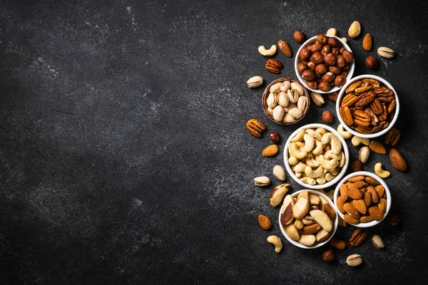 Nuts Bowls Cashew Hazelnuts Pecan Almonds Brazilian Nuts Pistachios Black — Stock Photo, Image