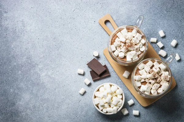 stock image Hot chocolate with marshmallow on stone table. Top view with copy space.