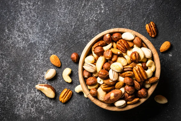 Assortment Nuts Wooden Bowl Dark Stone Table Cashew Hazelnuts Almonds — Stock Photo, Image