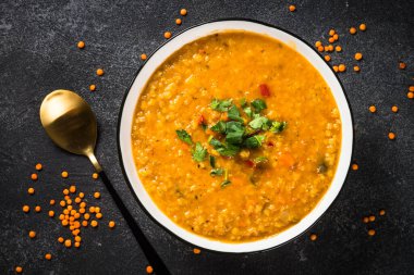 Traditional turkish or arabic Lentil soup, vegetable soup. Vegan dish. Top view image.