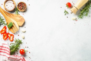 Kitchen utensil with herbs and vegetables. Healthy food background. Top view on white background.