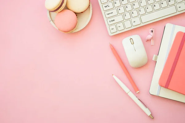 Office workspace. Woman flat lay pink creative layout freelance office desk.