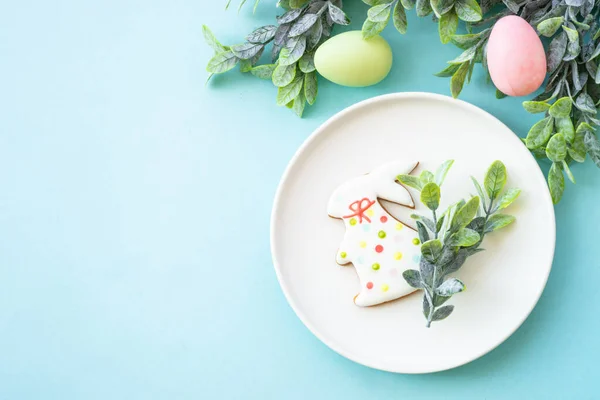 Easter food background. Easter table setting. Flat lay on blue.