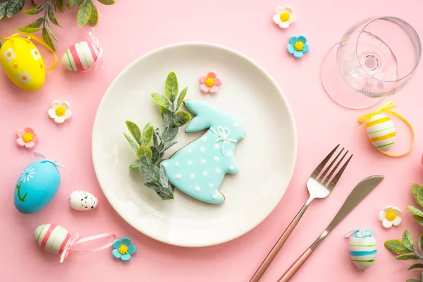 Easter food background with holiday decorations. Easter table setting. Flat lay on blue.