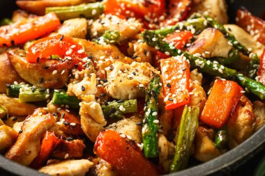Chicken stir fry with vegetables. Close up macro.