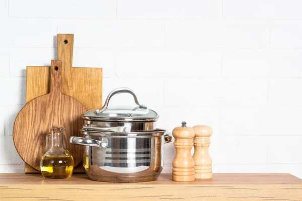 Kitchen Table Kitchen Utensils Cooking Pots Oil Bottle Wooden Cutting — Stock Photo, Image