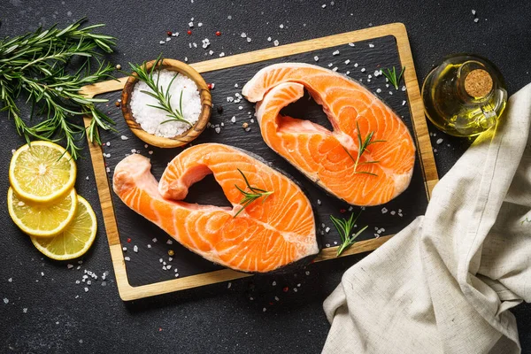 Salmon Steaks Cutting Board Black Background Top View Ingredients Cooking — Stock Photo, Image