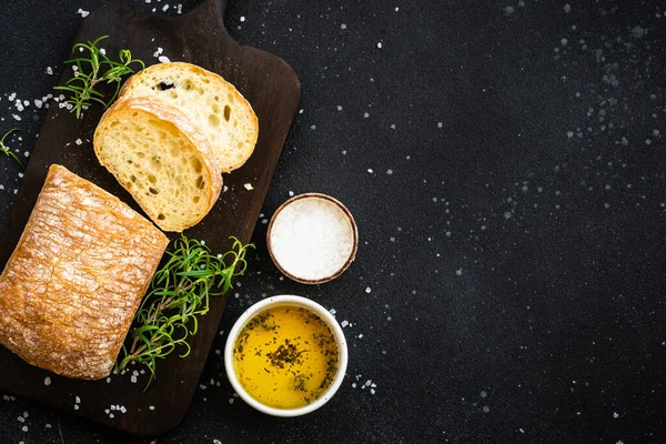 Ciabatta Bread Wooden Board Olive Oil Sea Salt Herbs Black — Stock Photo, Image