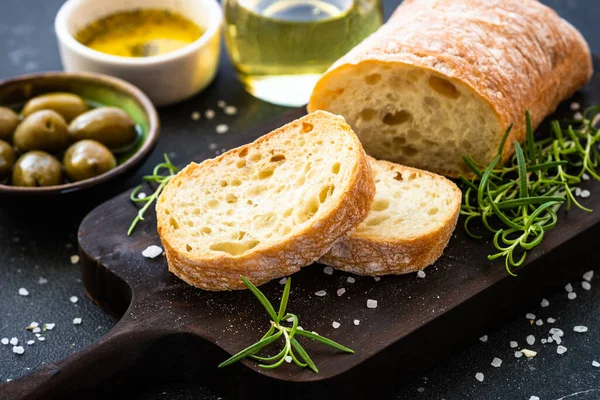 Ciabatta Bread Wooden Board Olive Oil Olives Herbs Black Mediterranean — Stock Photo, Image