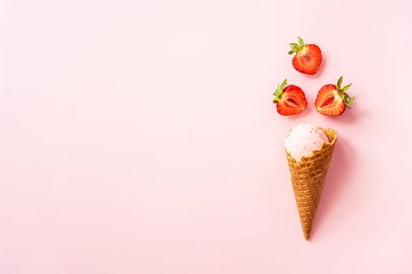 stock image Strawberry ice cream. Ice cream cone top view on pink.