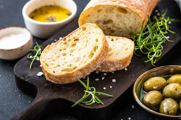 Ciabatta Bread Wooden Board Olive Oil Olives Herbs Black Mediterranean — Stock Photo, Image