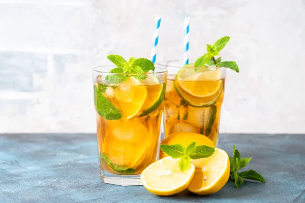 stock image Iced tea. Summer drink with lemon, lime, mint and ice. Cold lemonade.