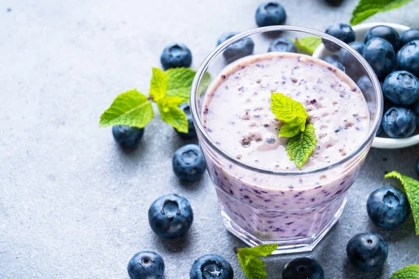 Stock image Smoothie or milkshake with fresh blueberry and banana. Healthy diet snack.