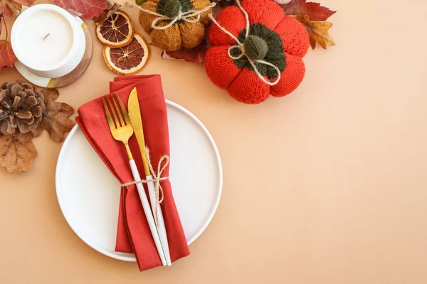 Autumn food background. White plate, cutlery and autumn decorations. Flat lay with copy space.