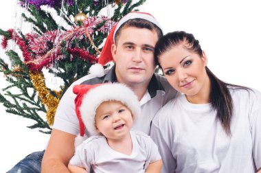 Genç anne, küçük çocuk ve yeni yıl süslemeleri için daha da ileri.