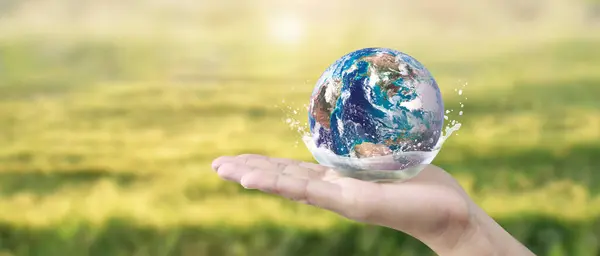 Globe ,earth in human hand, holding our planet glowing. Earth image provided by Nasa