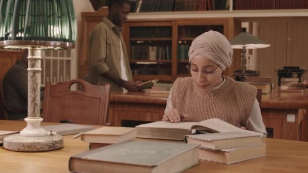 Waist Slowmo Muslim Female Student Eyeglasses Headscarf Reading Thick Book — Video Stock