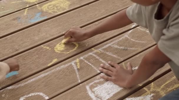 Closeup Little African American Boy Drawing Yellow Sun Chalk Wooden — Stock Video