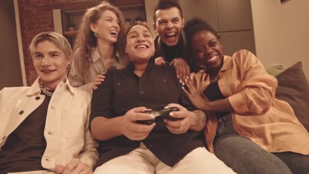 Handheld Slowmo Five Cheerful Multiethnic Lgbtq Friends Playing Video Games — Stock video
