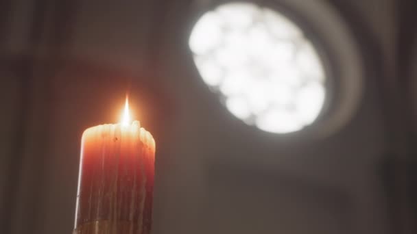 Low Angle Wax Candle Burning Dark Catholic Church Sun Rays — Stock Video