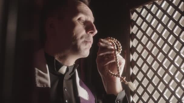Slowmo Closeup Priest Wearing Black Robe White Collar Sitting Confession — Stock Video