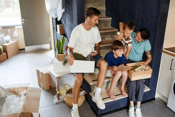 Portrait Happy Modern Family Unpacking Boxes While Sitting Stairs New — Stock Photo, Image