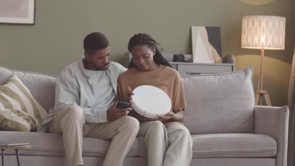 Slowmo Young African American Couple Setting Robotic Vacuum Cleaner Connecting — Stock Video