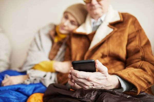 Close Senior Man Hiding Shelter Holding Phone Internet Connection Copy — Stock Photo, Image