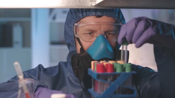 Medium Closeup Slowmo Male Caucasian Scientist Protective Coveralls Respiratory Mask — Stock Video