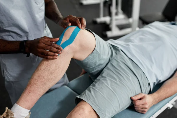 Close Therapist Putting Taping Knee Senior Patient Rehabilitation Clinic Copy — Stock Photo, Image