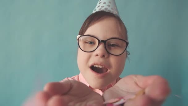 Slowmo Closeup Happy Little Girl Syndrome Blowing Confetti Camera Smile — Stok Video