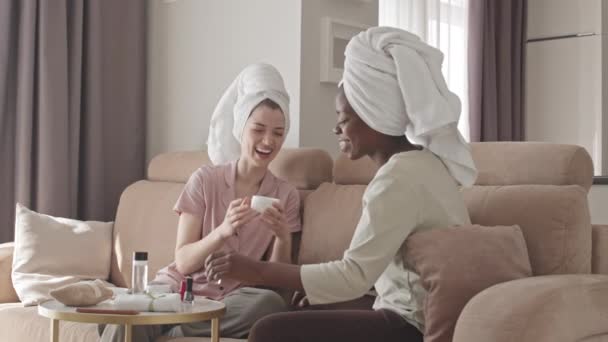 Medium Slowmo Two Young Cheerful Multiethnic Women Towels Heads Chatting — Stock Video